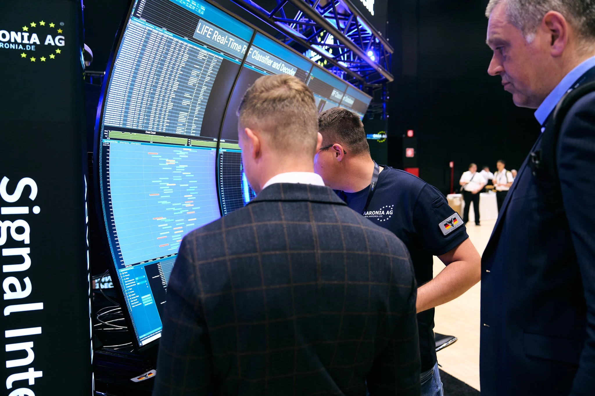 Interactive technology display at AOC Europe 2025 showcasing advanced signal integration.